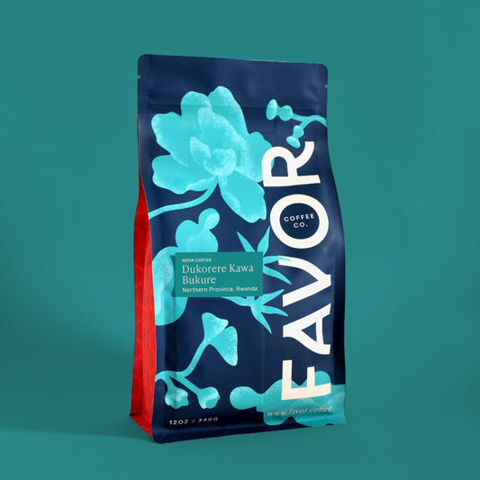 Favor coffee bag with blue floral design on a teal background with label Dukorere Kawa Bukure