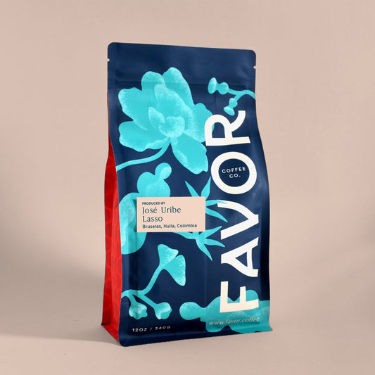 Blue bag with floral pattern with Favor Coffee branding and label reading Jose Uribe Lasso